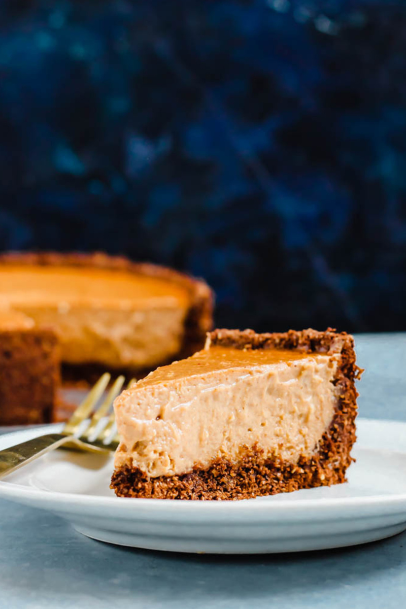 a plate of homemade vegan pumpkin cheesecake