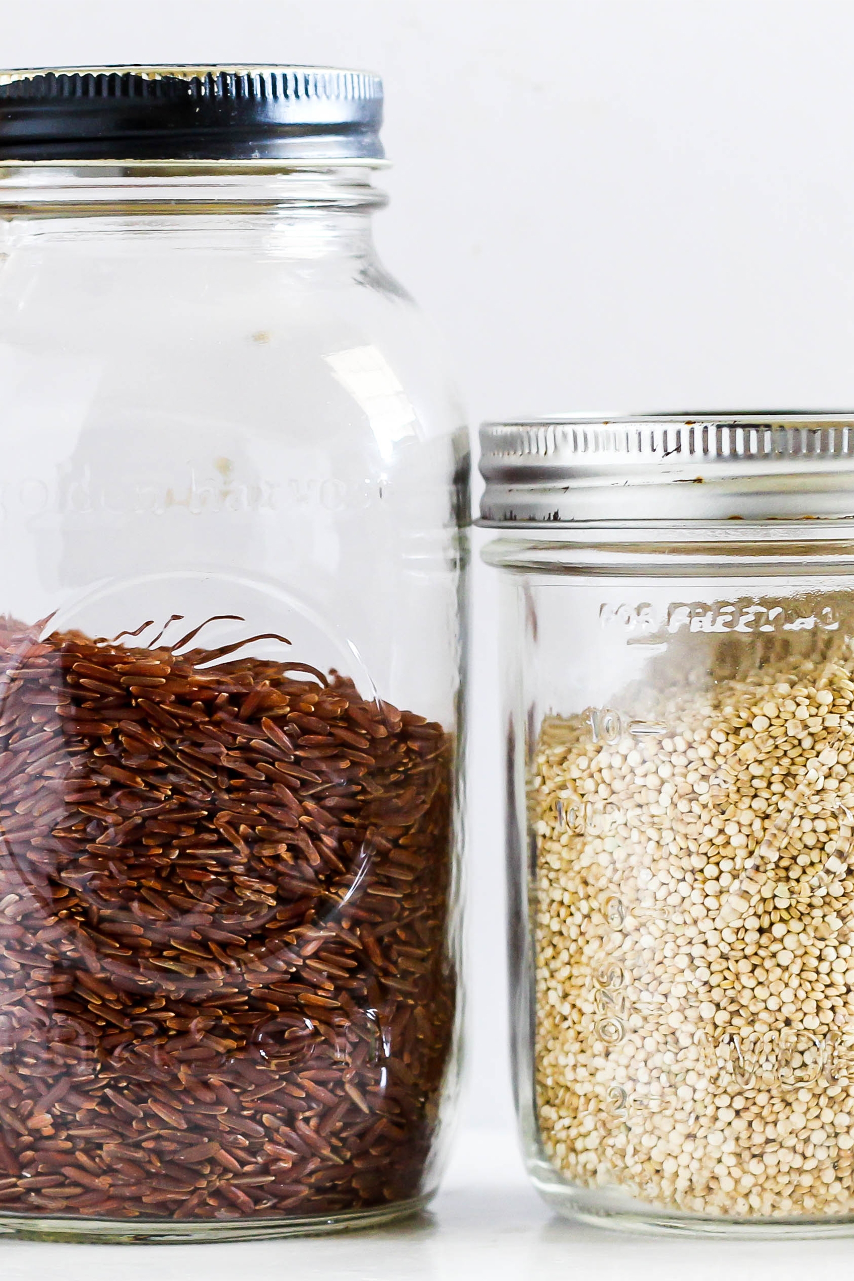 a jar of wild rice next to a jar of quinoa