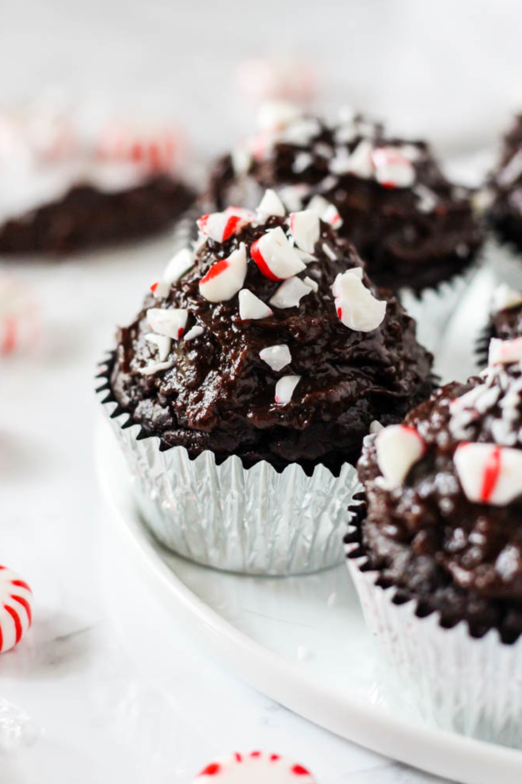 a plate of chocolate peppermint cupcakes