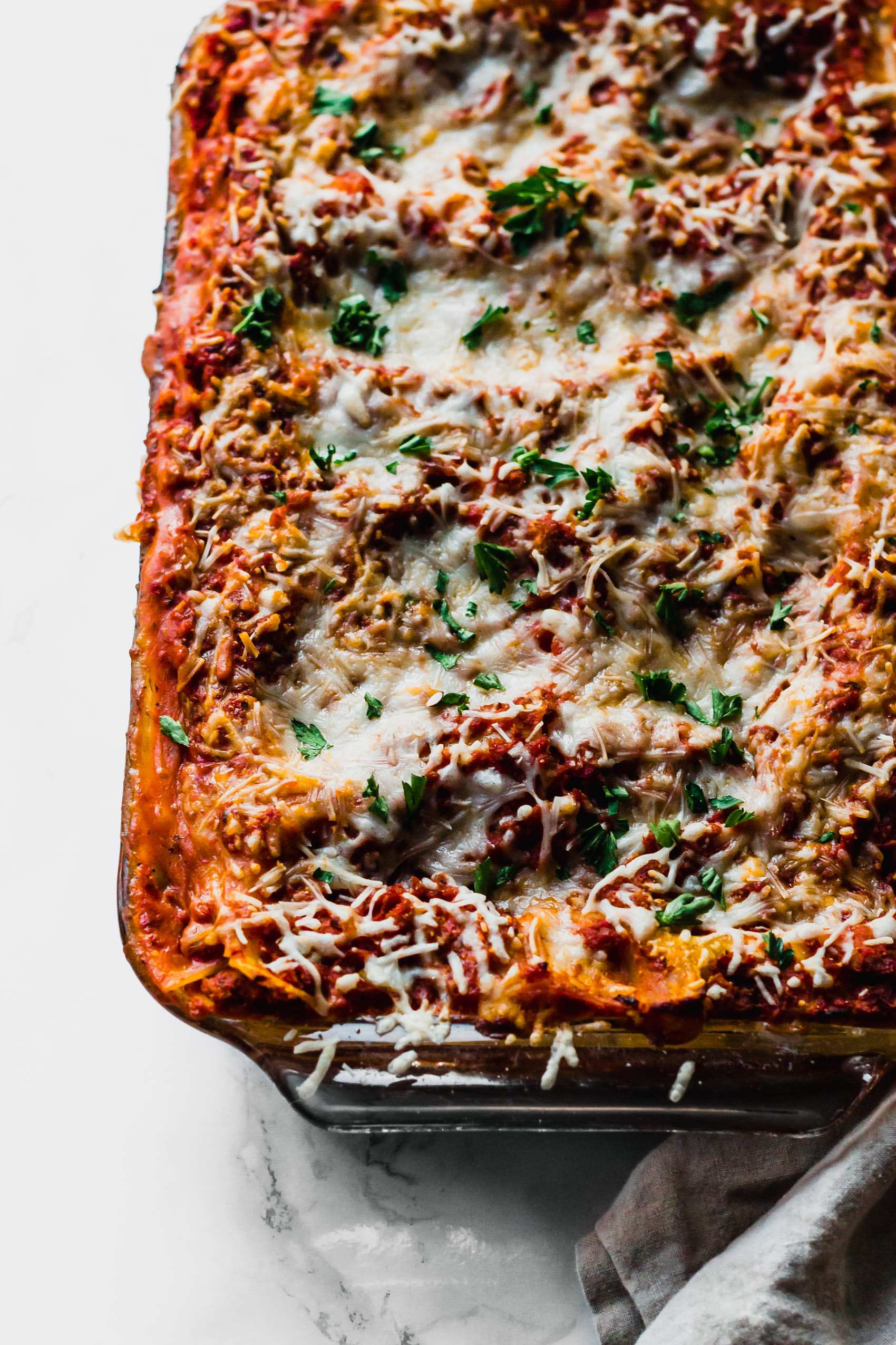 a dish of cheesy vegan lasagna