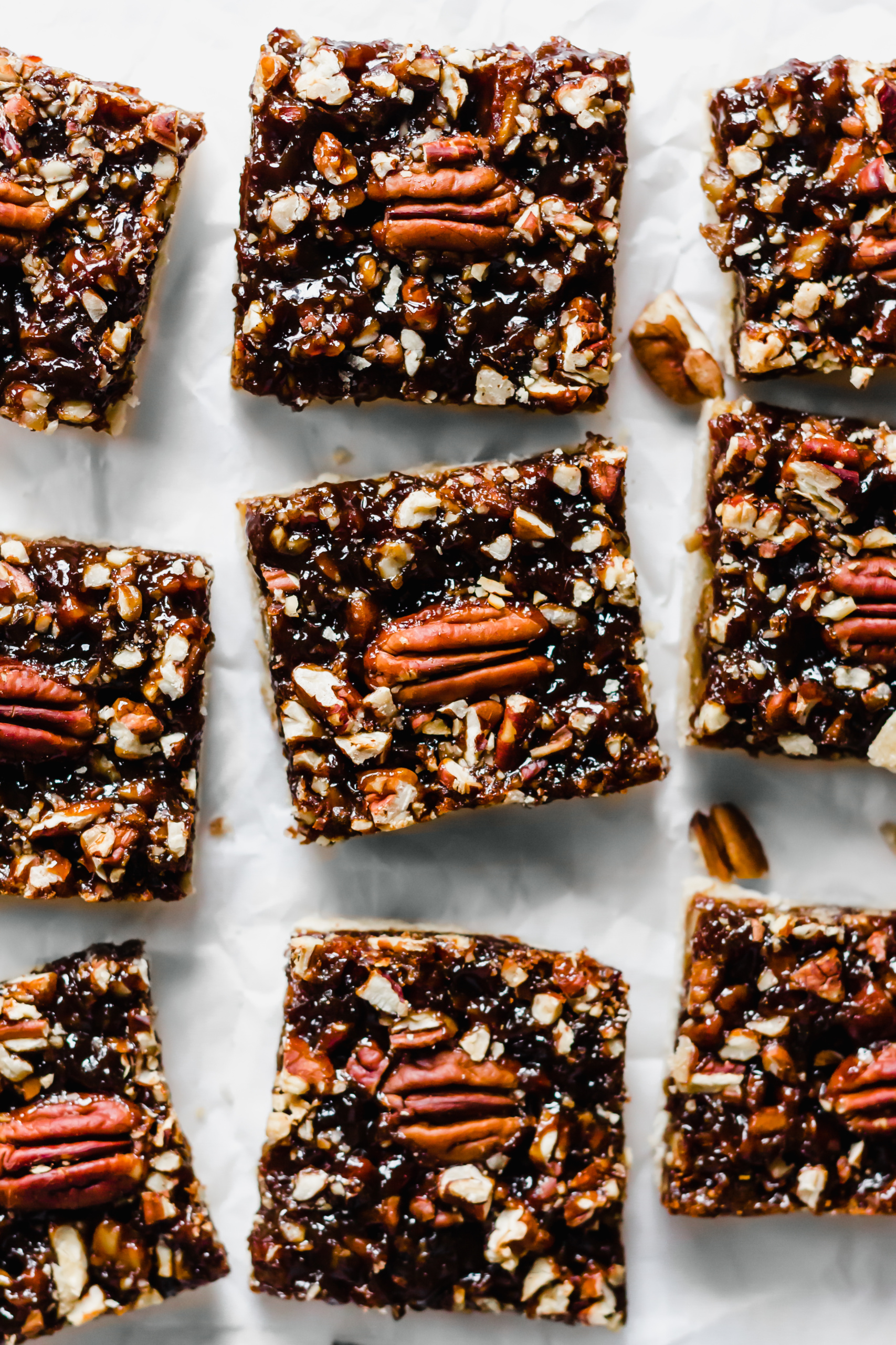 a tray of sliced pecan pie bars