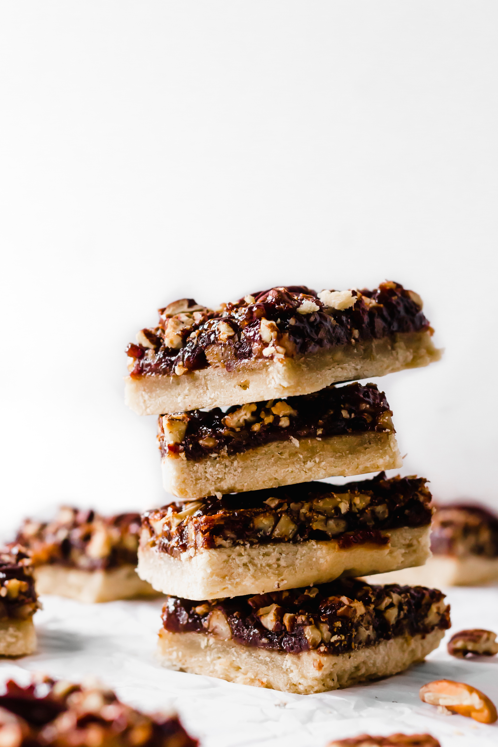 a stack of vegan pecan pie bars