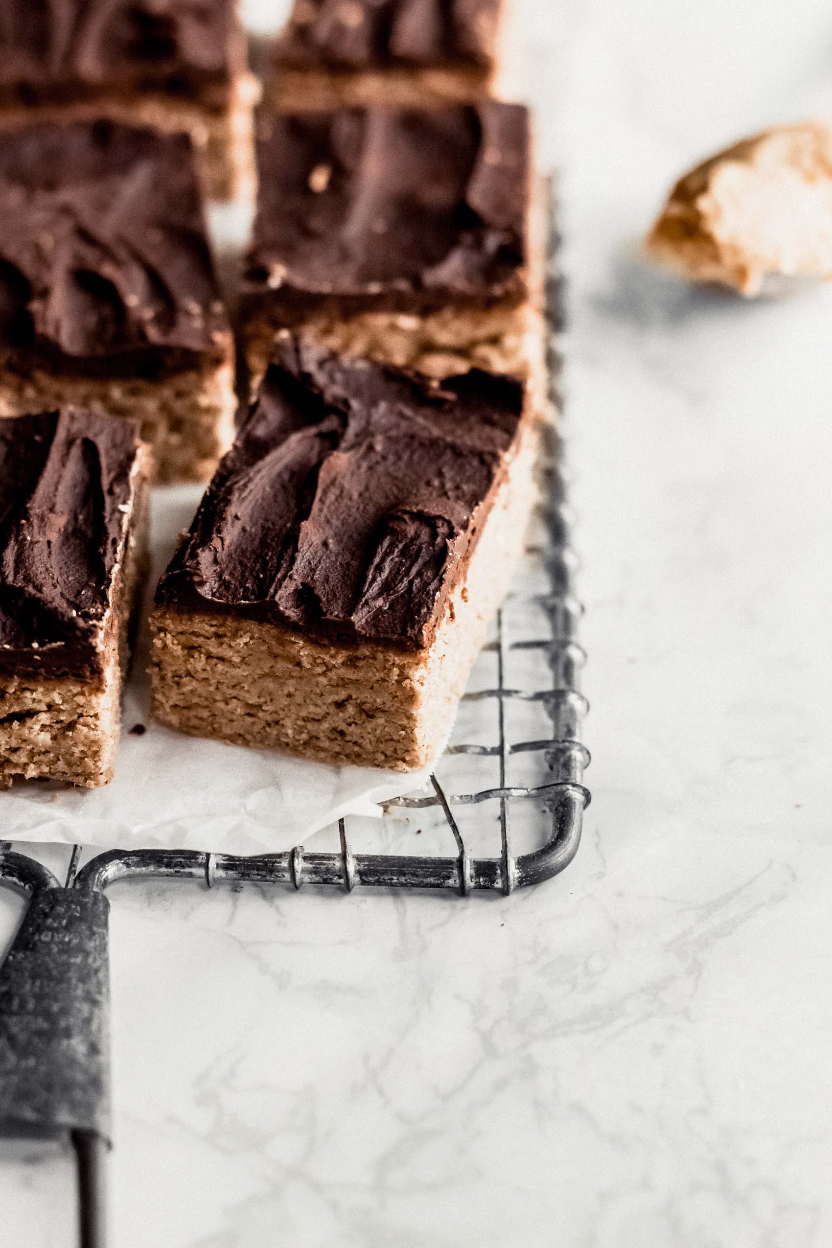 a tray of homemade chocolate peanut butter protein bars