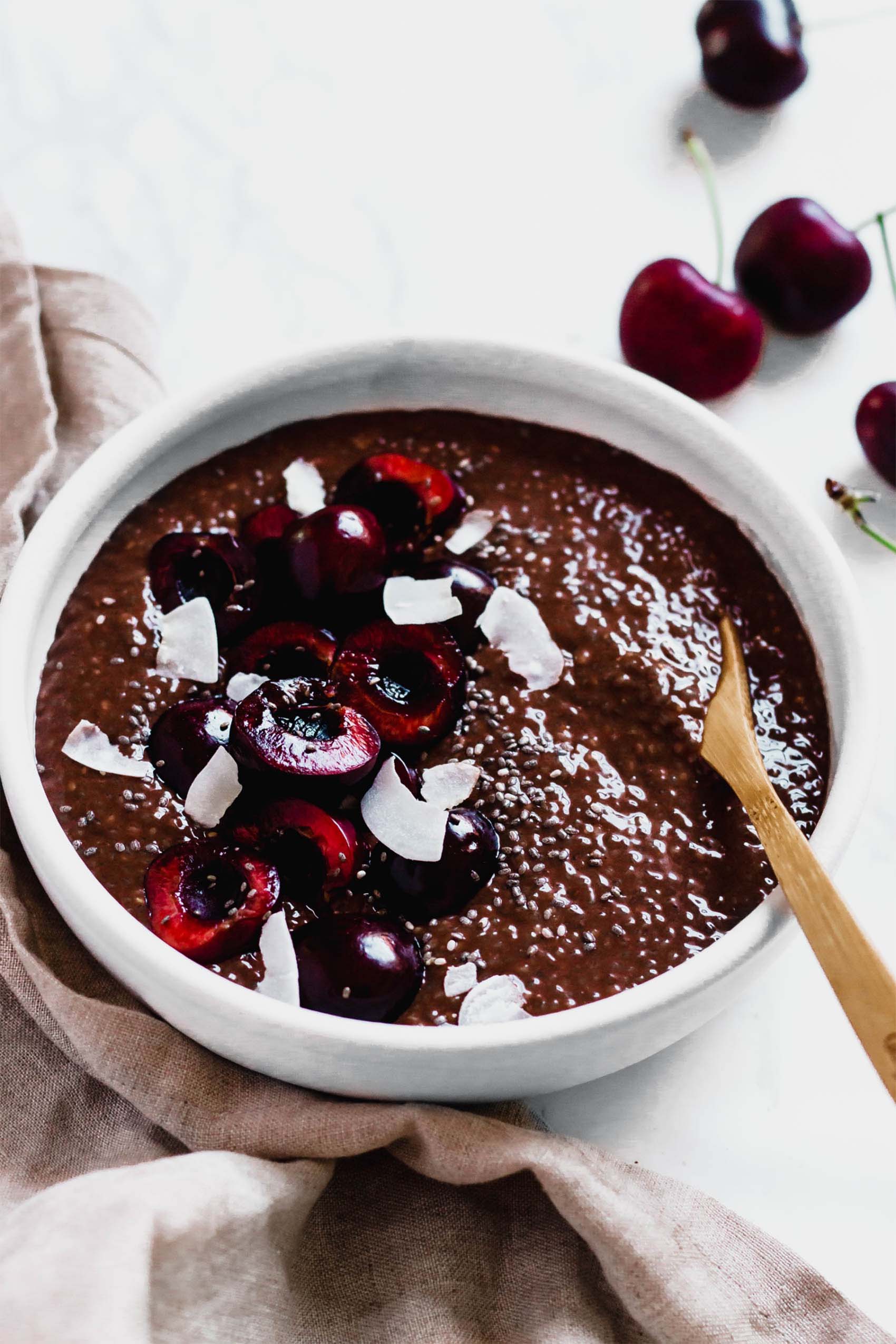 a bowl of chocolate cherry chia pudding
