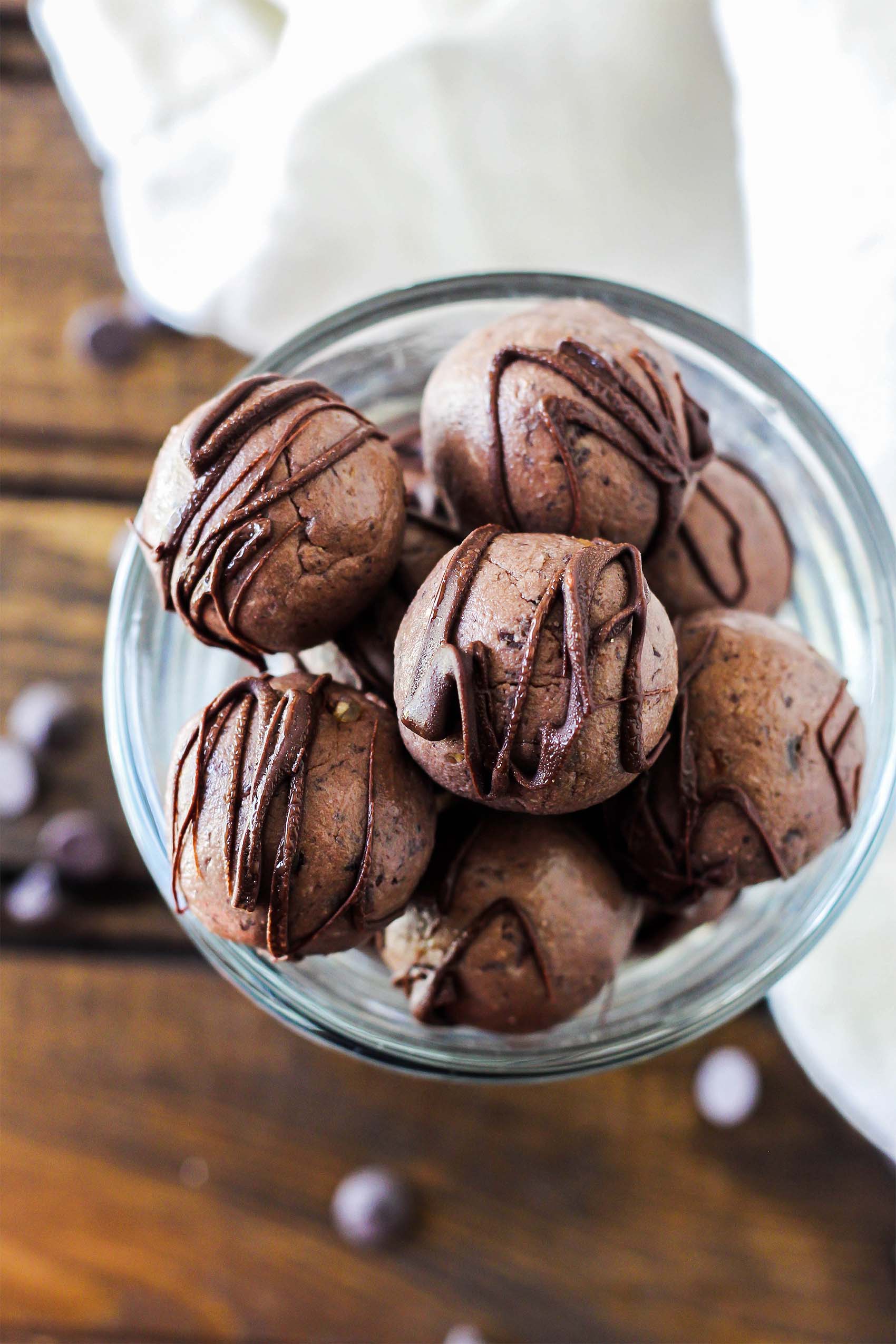 a bowl of chocolate vegan protein balls