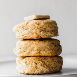 a stack of vegan biscuits topped with butter