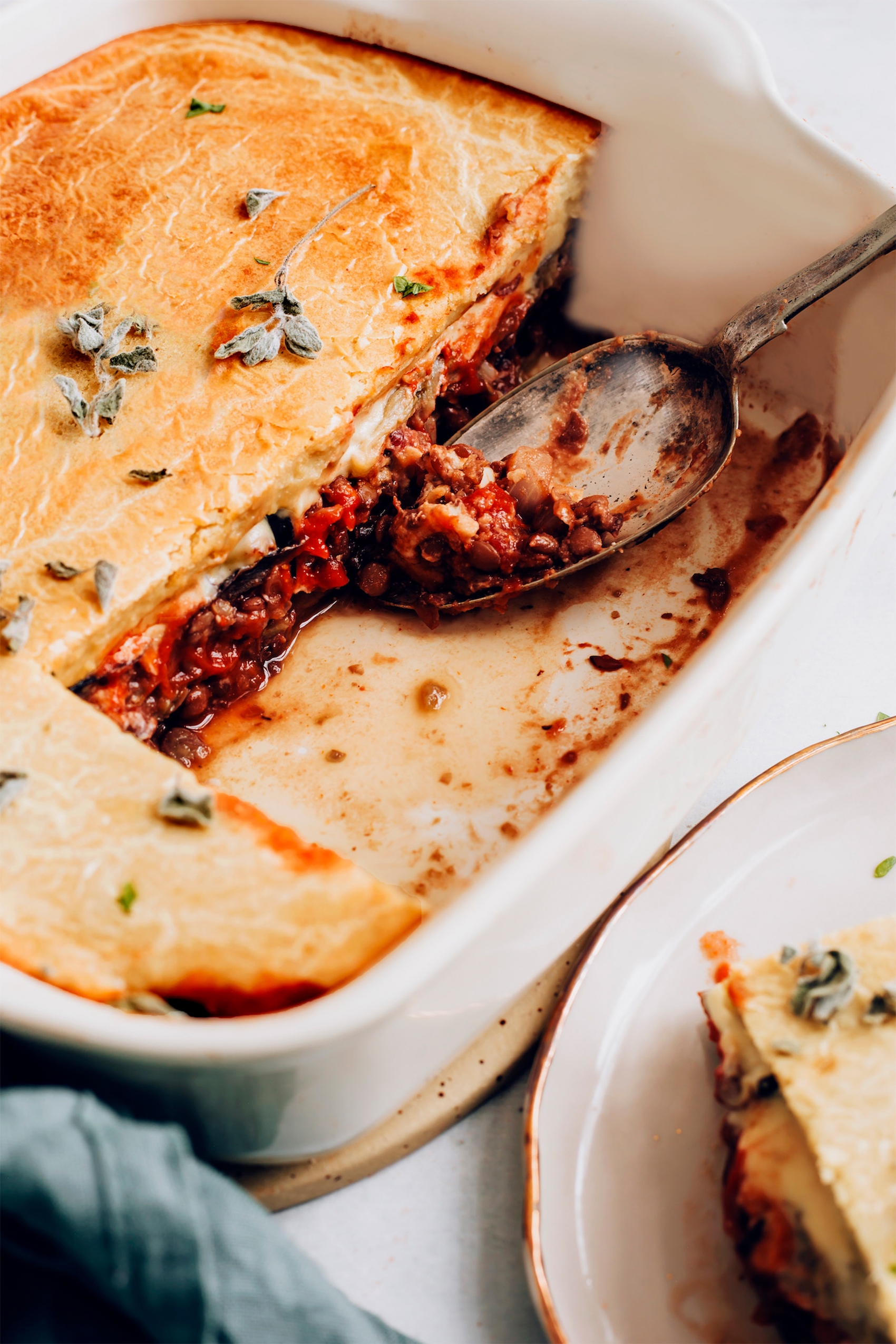 a spoon serving a scoop of vegan moussaka