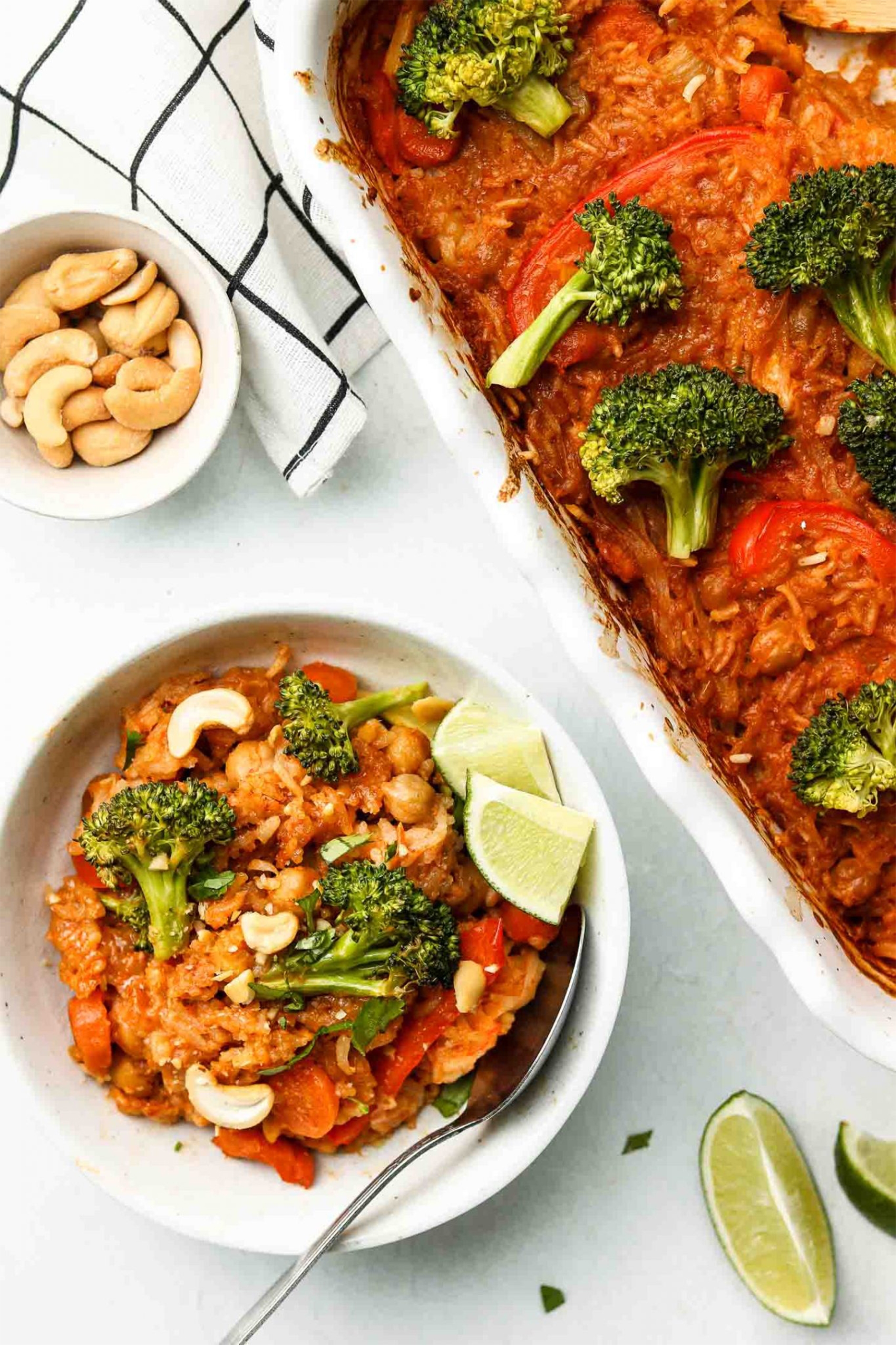 a red curry cashew rice bake served with lime wedges
