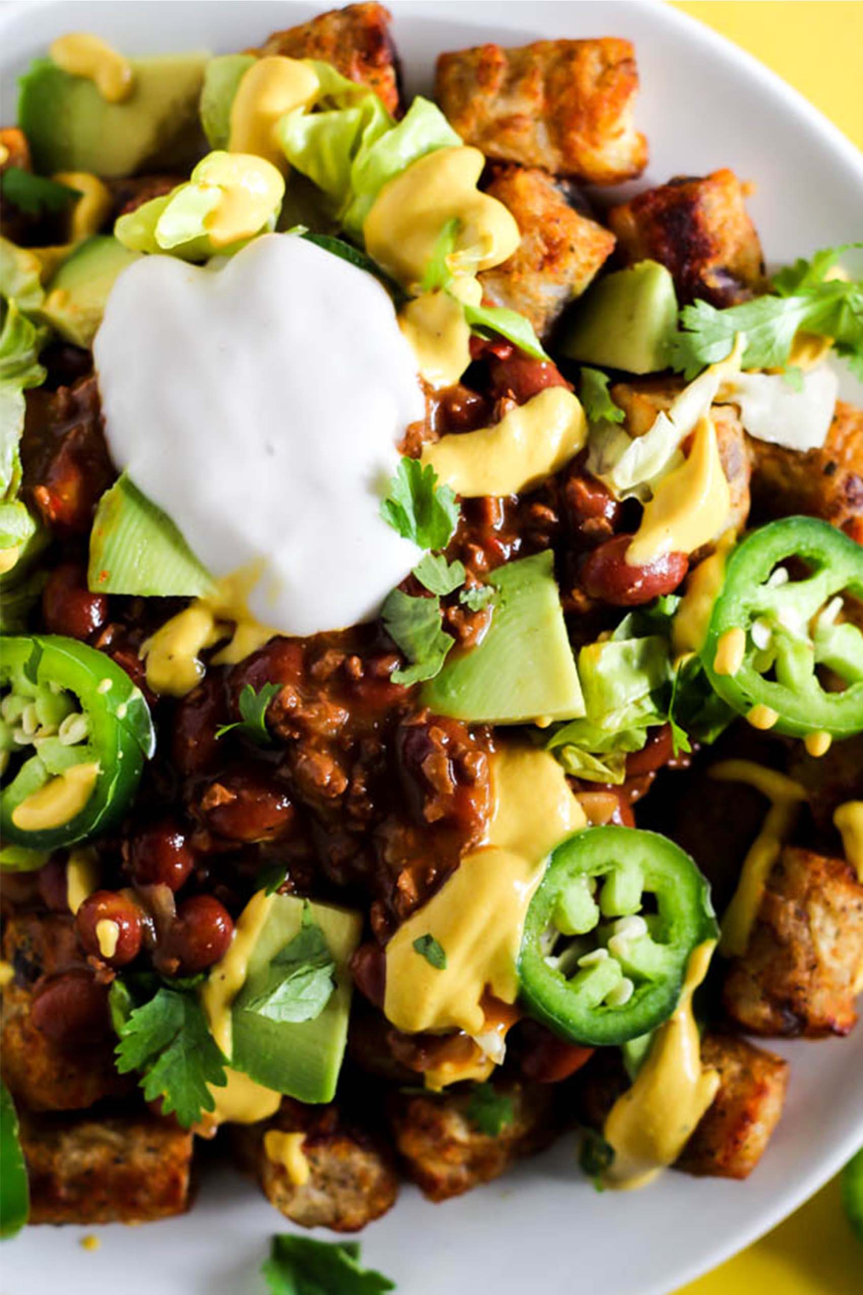 a plate of loaded vegan tater tots