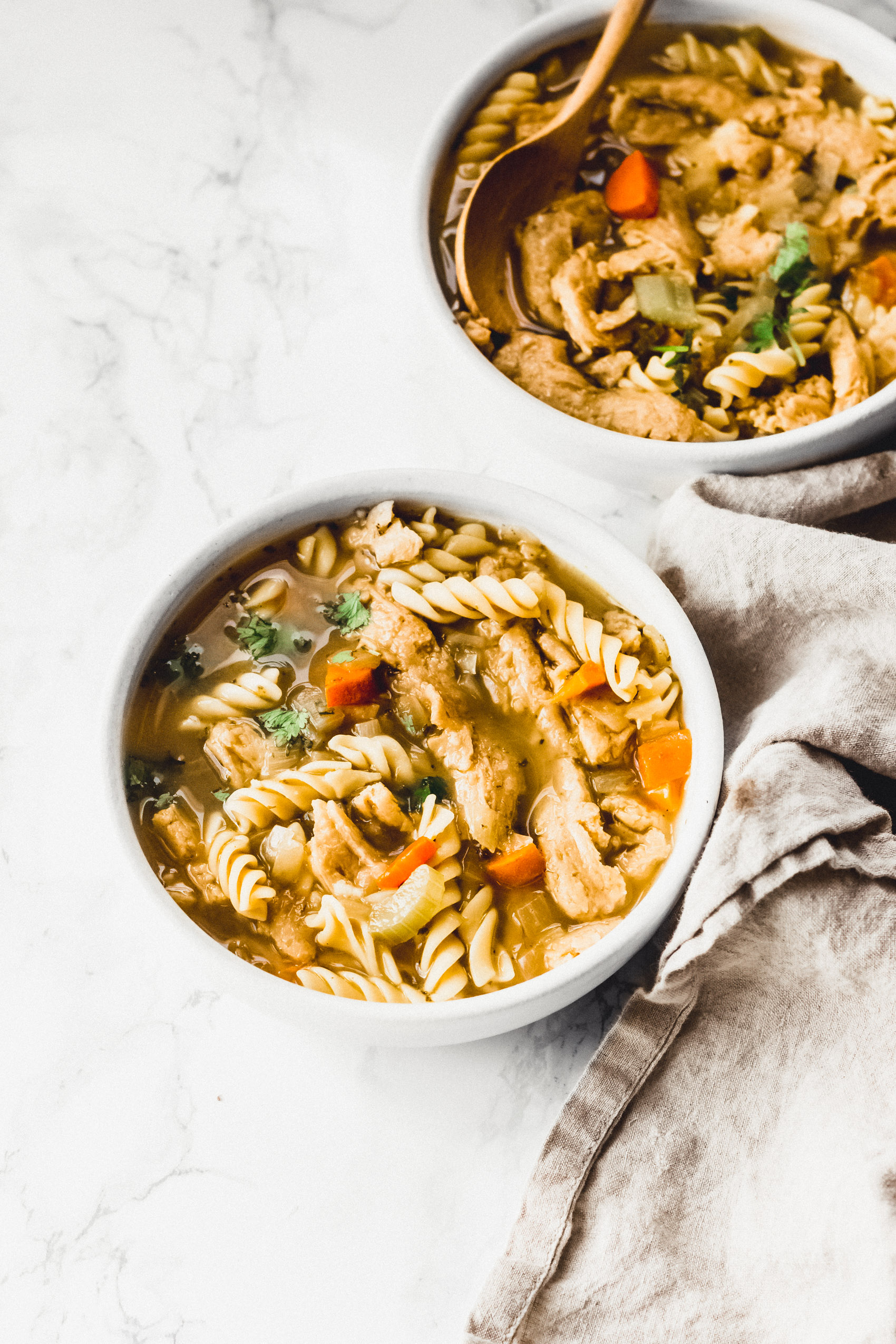 two bowls of homemade vegan chicken soup