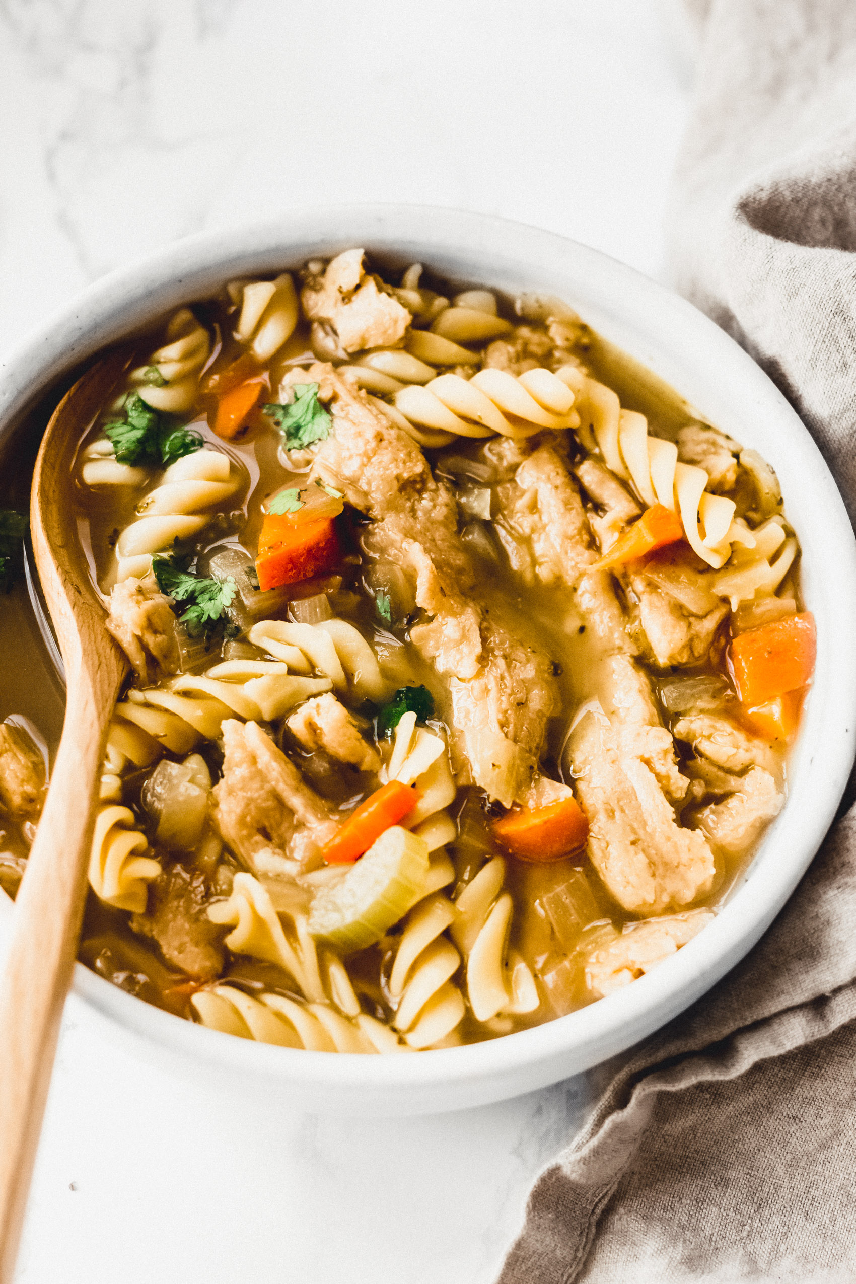 a close up of a bowl of vegan chicken soup