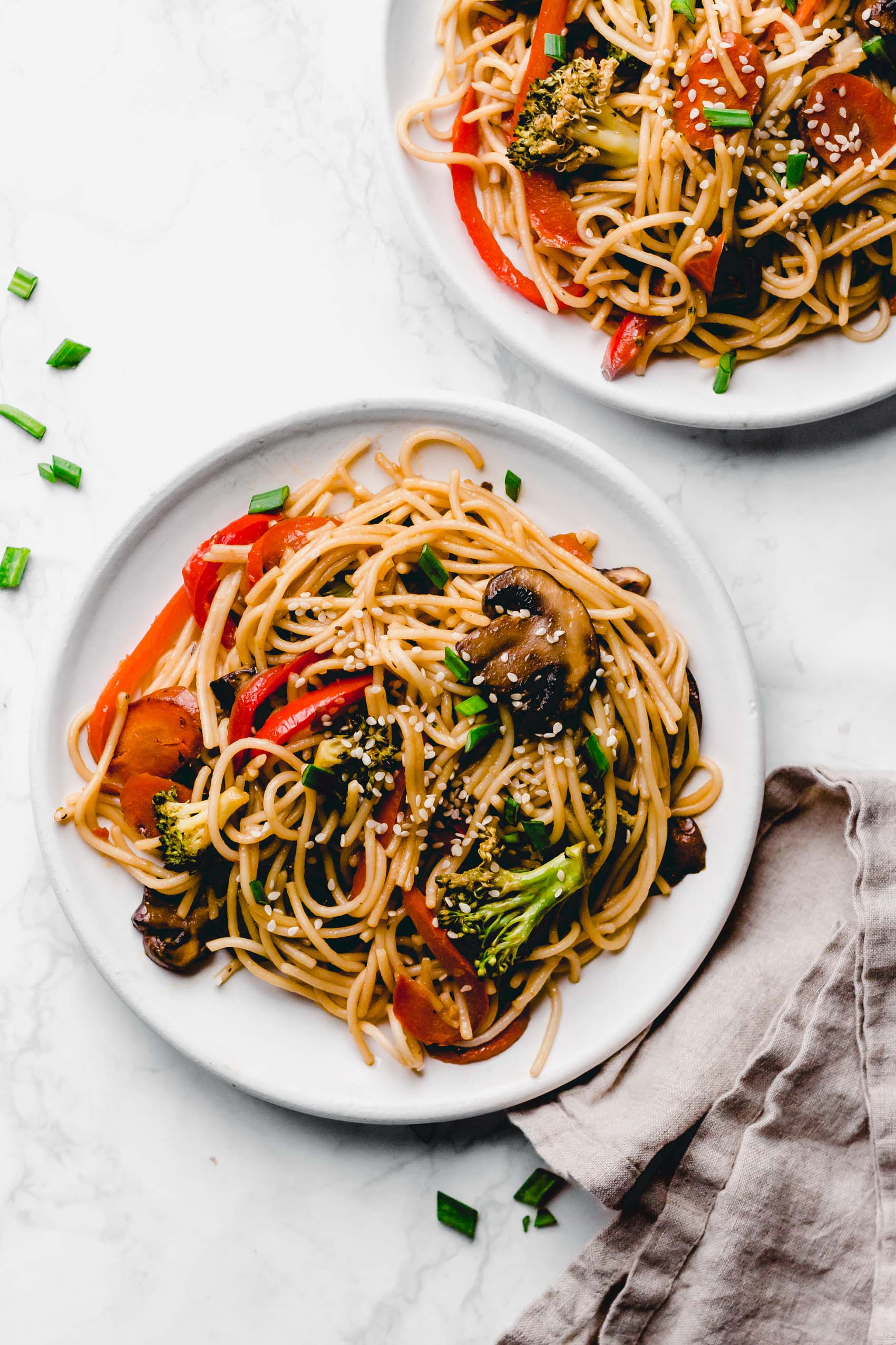 two plates of vegan lo mein