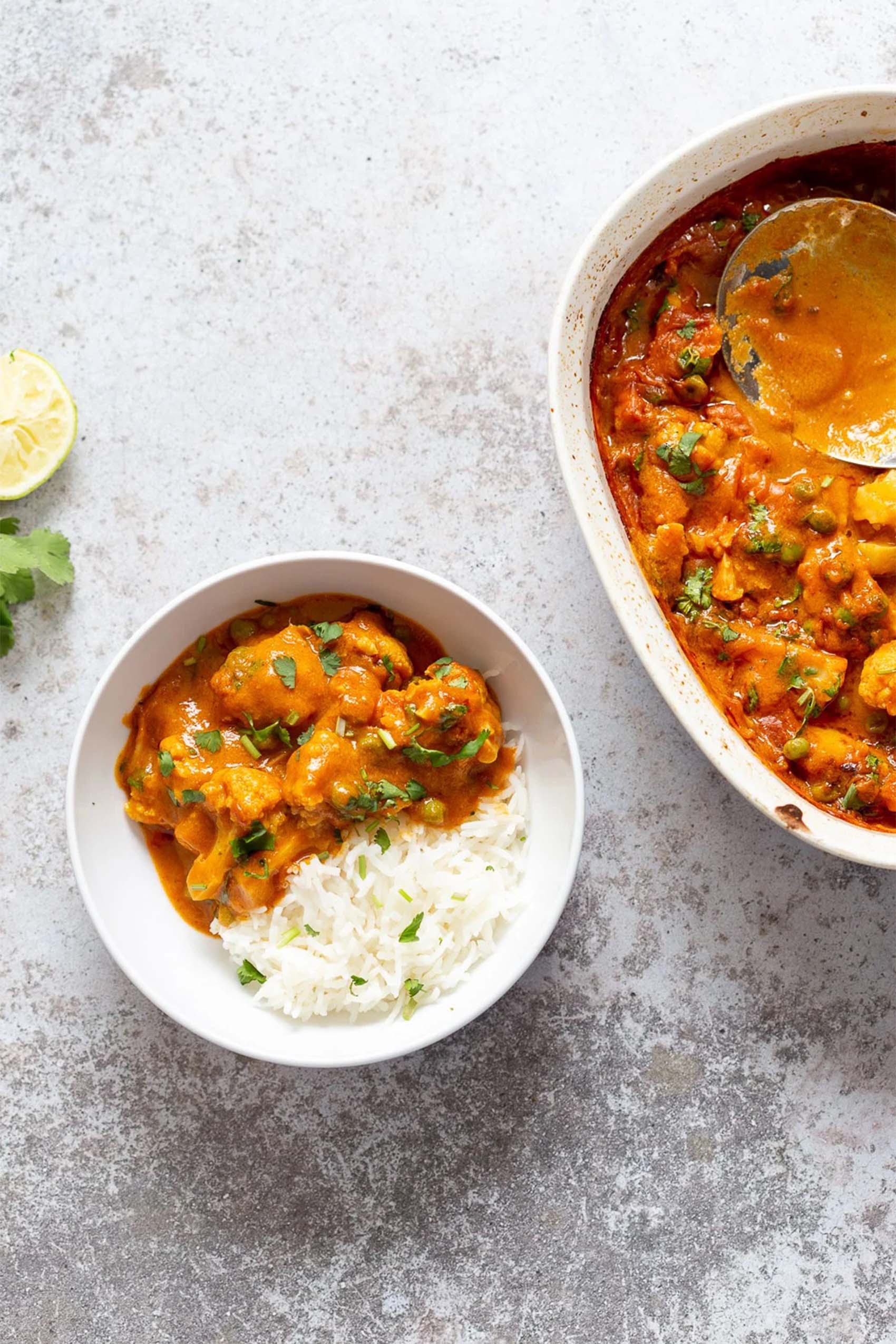 a bowl of vegan curry served with white rice