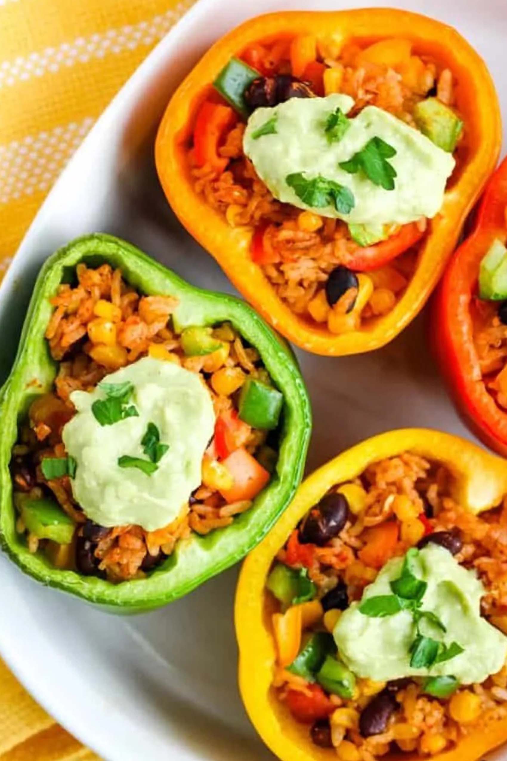 black bean stuffed peppers topped with avocado cream
