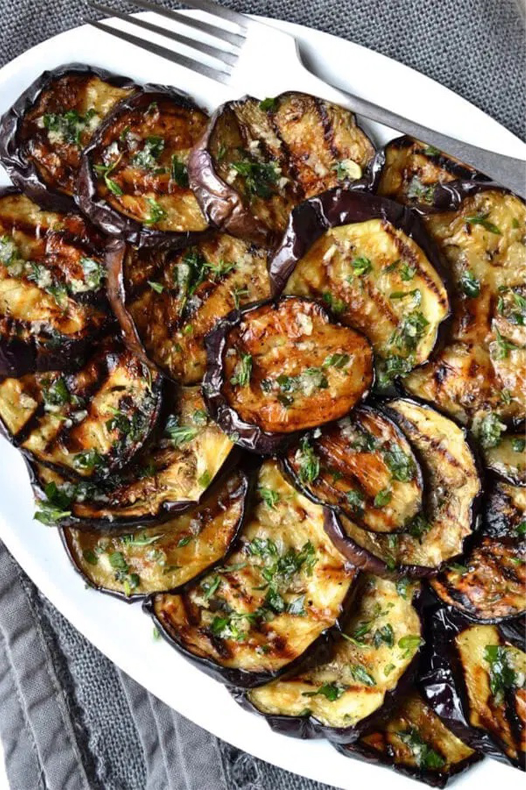a plate of grilled eggplant slices