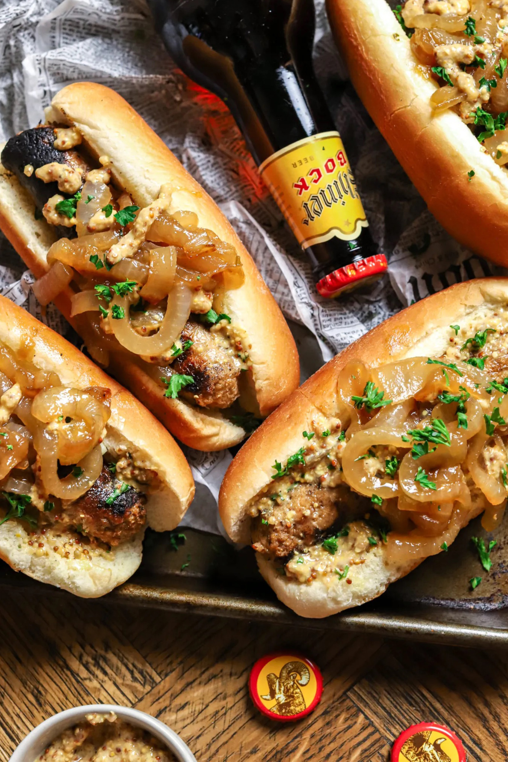 vegan beer brats topped with grilled onions