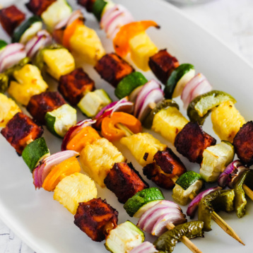 a platter of vegan bbq tofu vegetable skewers