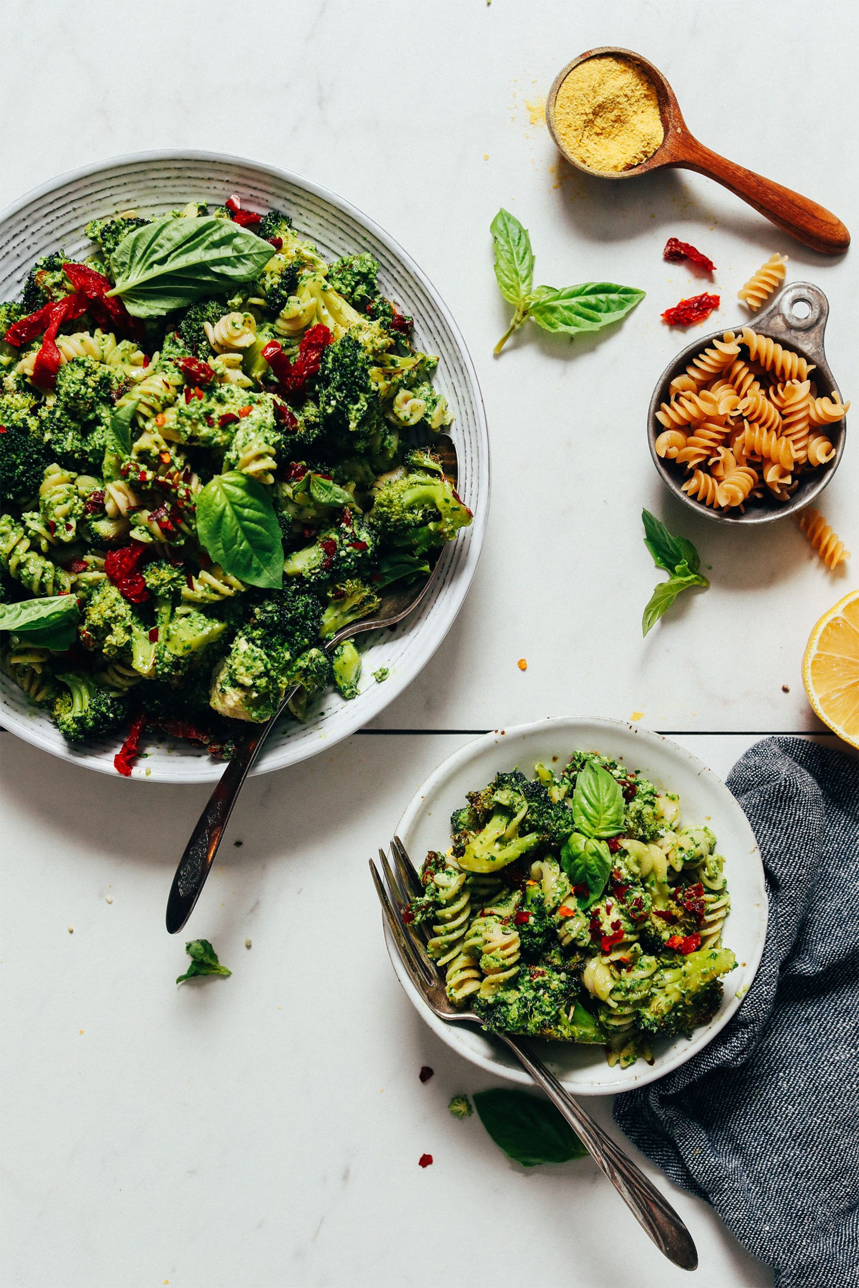 a bowl of pesto pasta salad