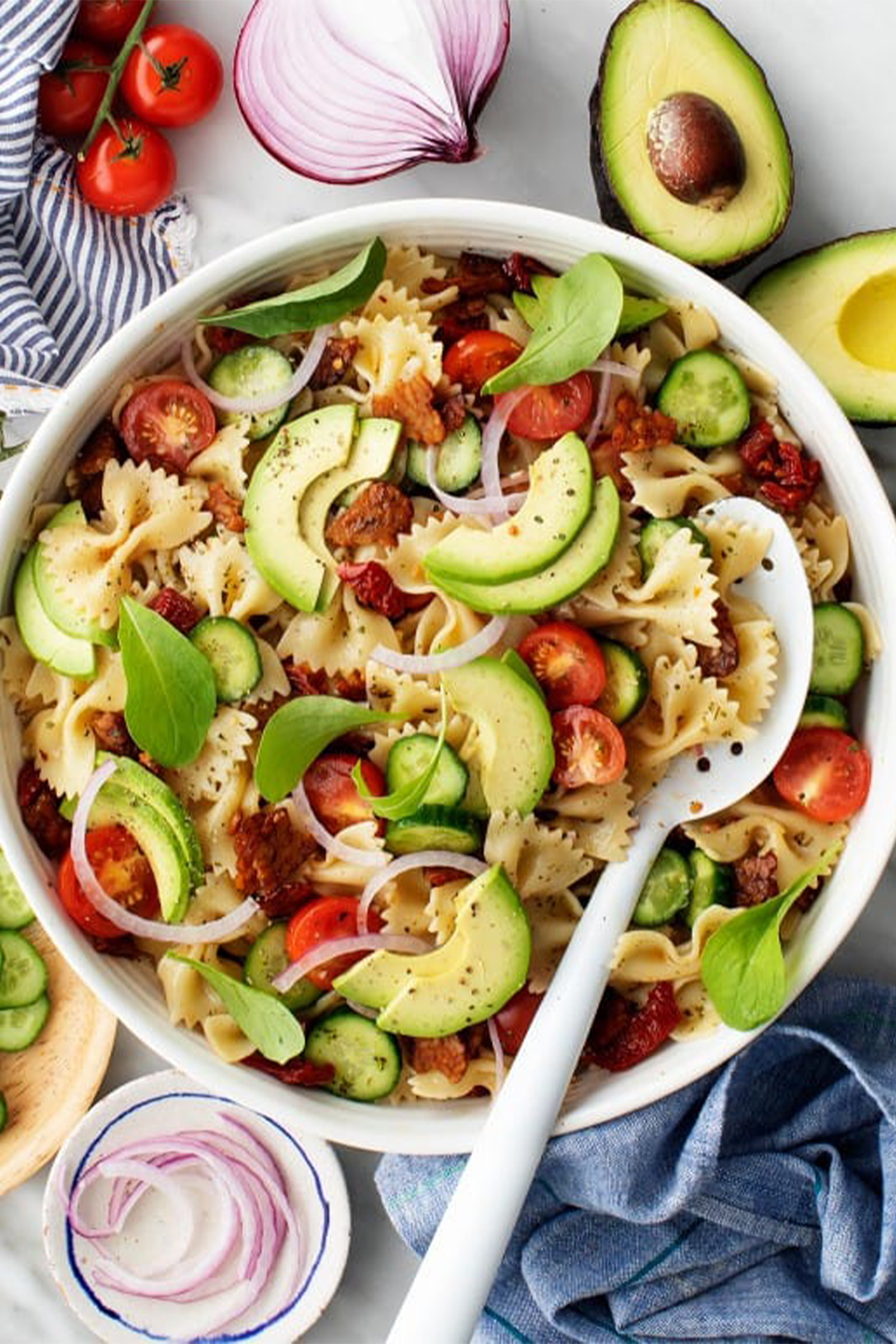 a large bowl of vegan blt pasta salad