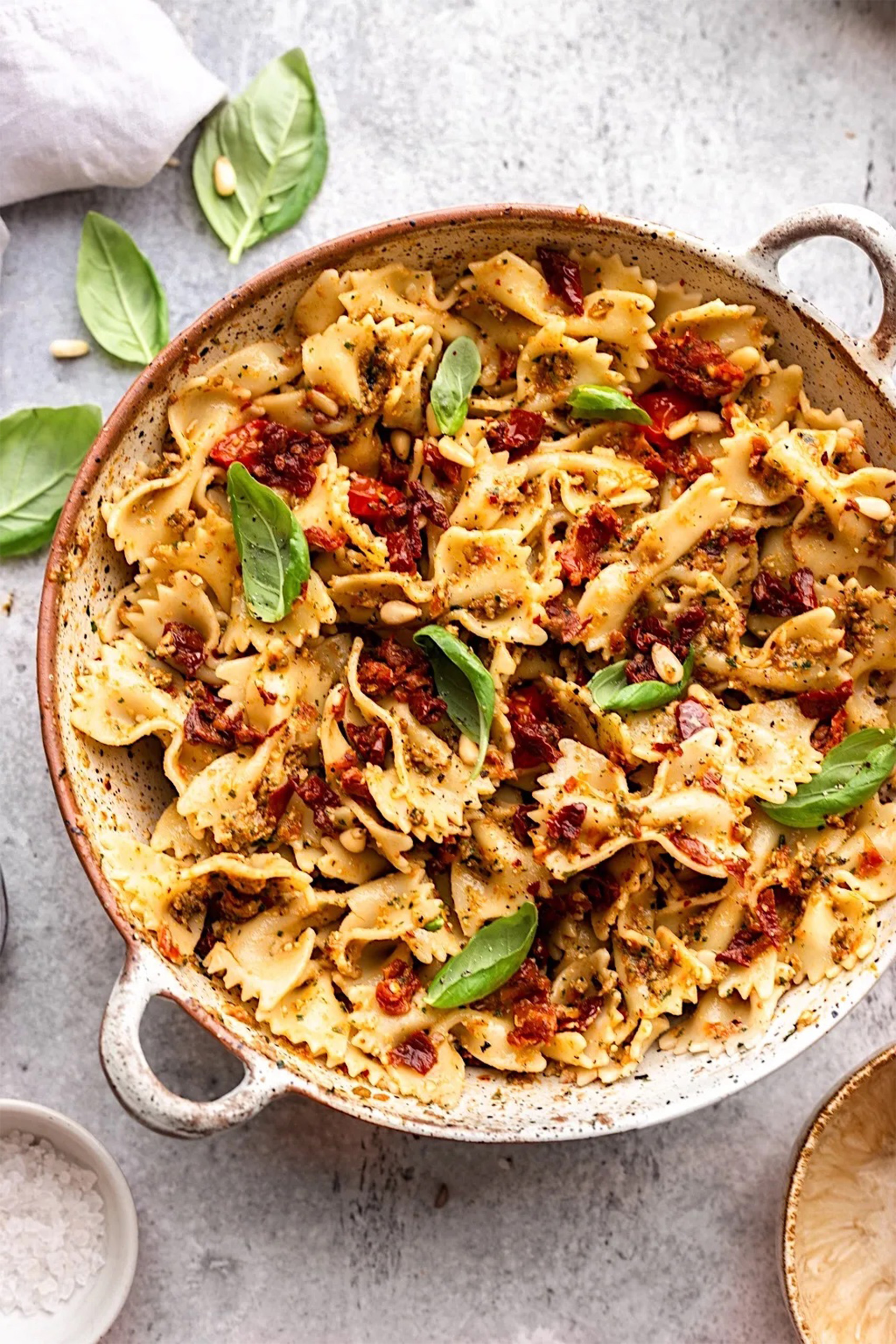 a bowl of pasta salad made with sun dried tomato pesto