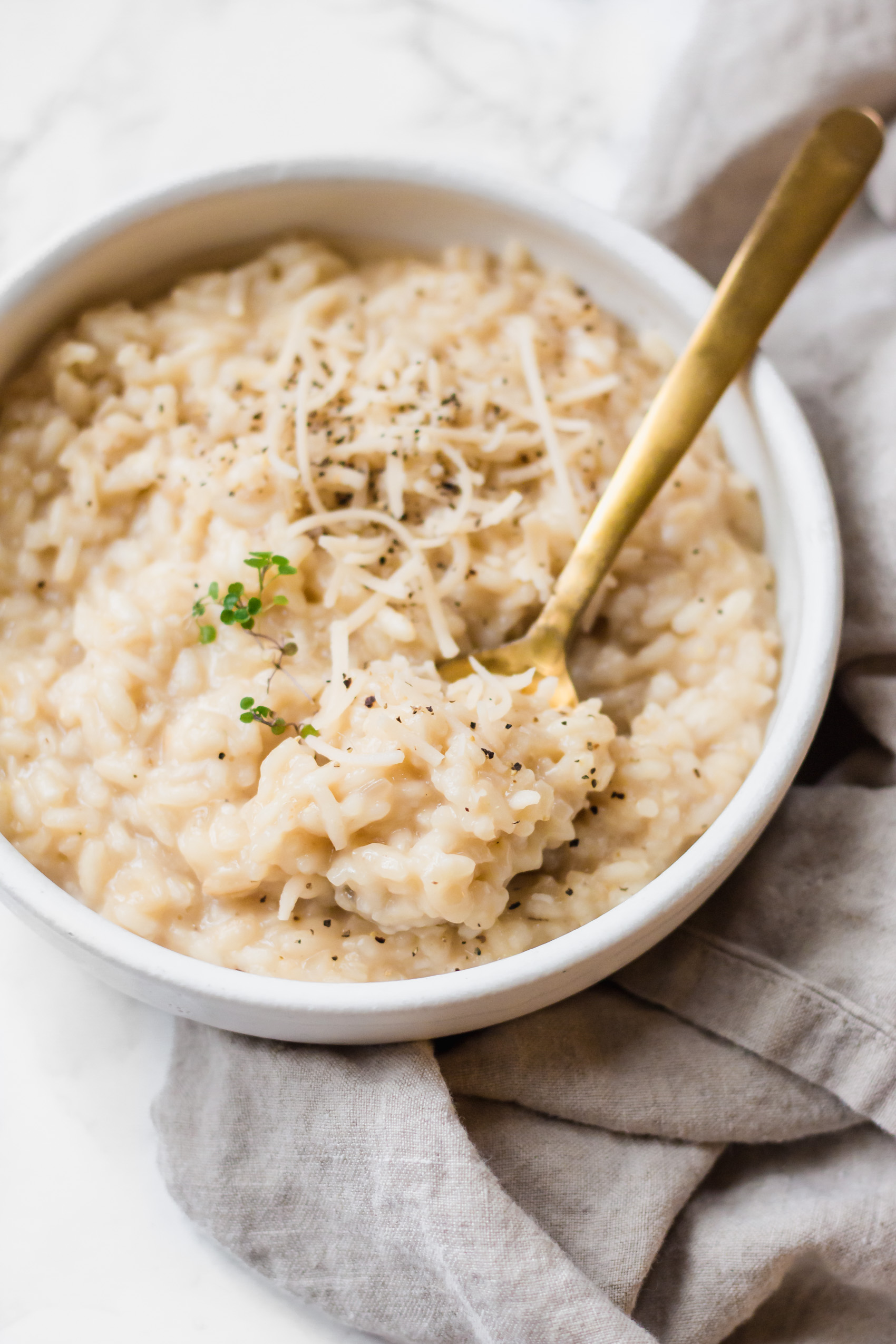 a spoon taking a scoop of vegan risotto