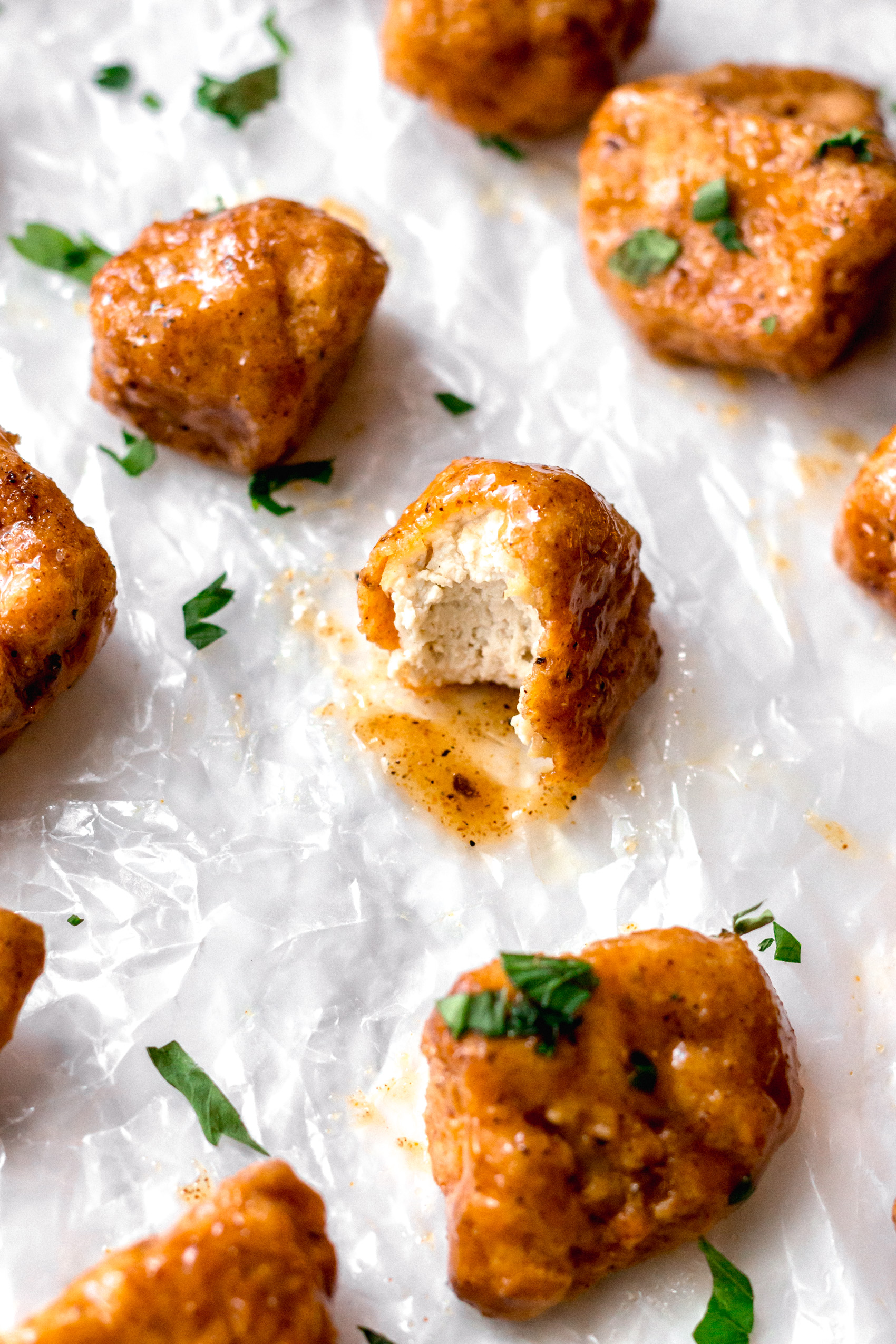 a piece of vegan fried chicken with a bite taken out of it