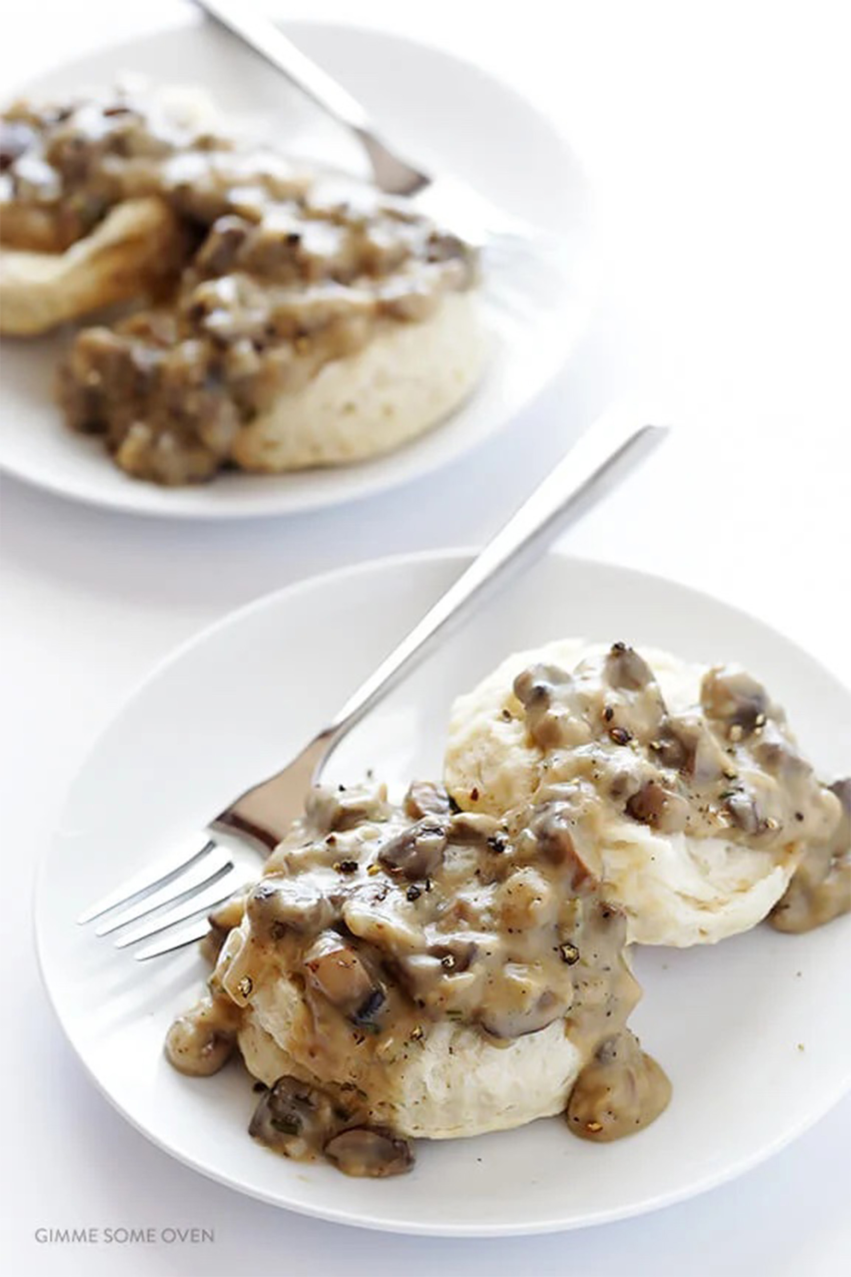 a plate of vegan mushroom gravy served over biscuits