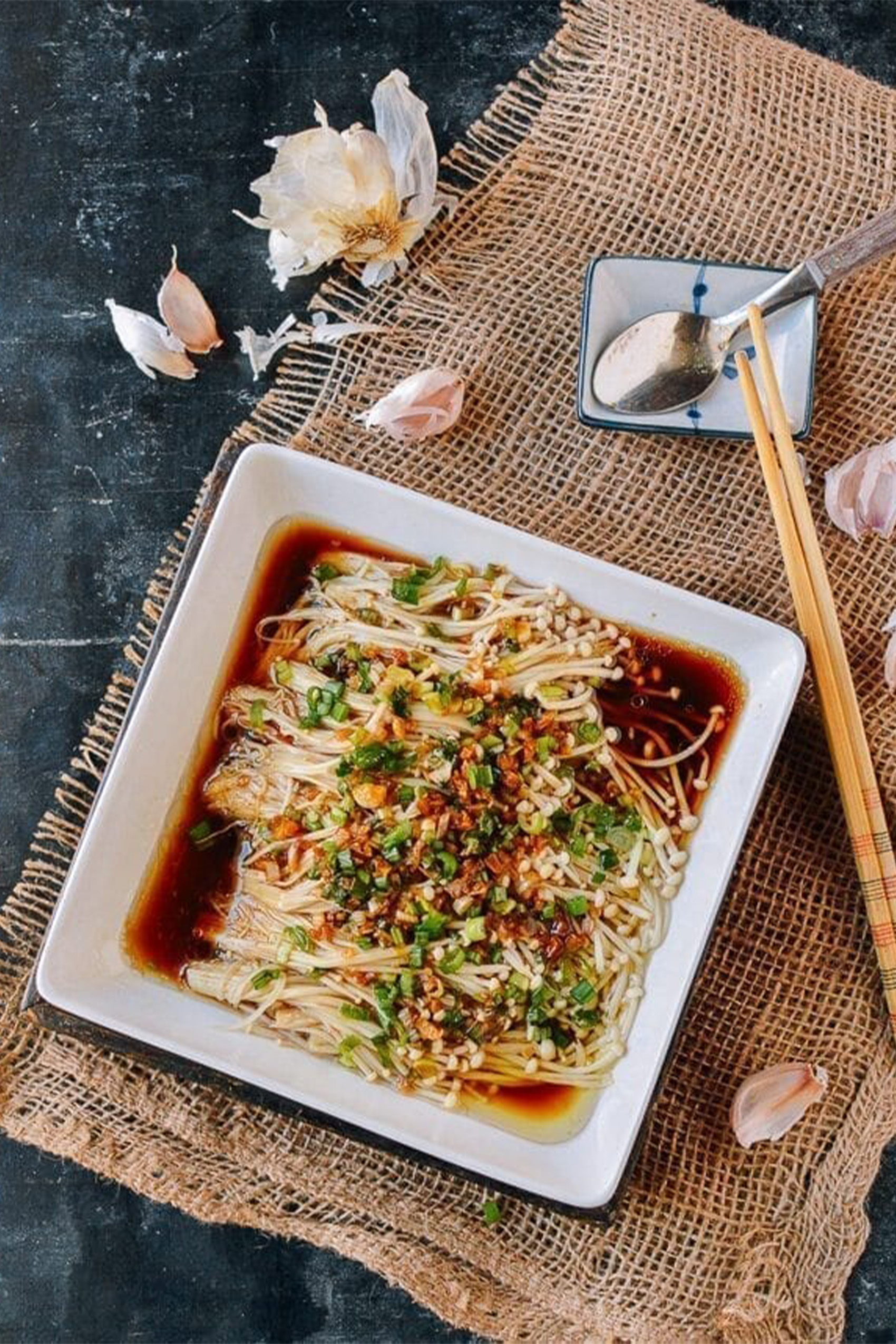 a plate of enoki mushrooms marinated in soy sauce