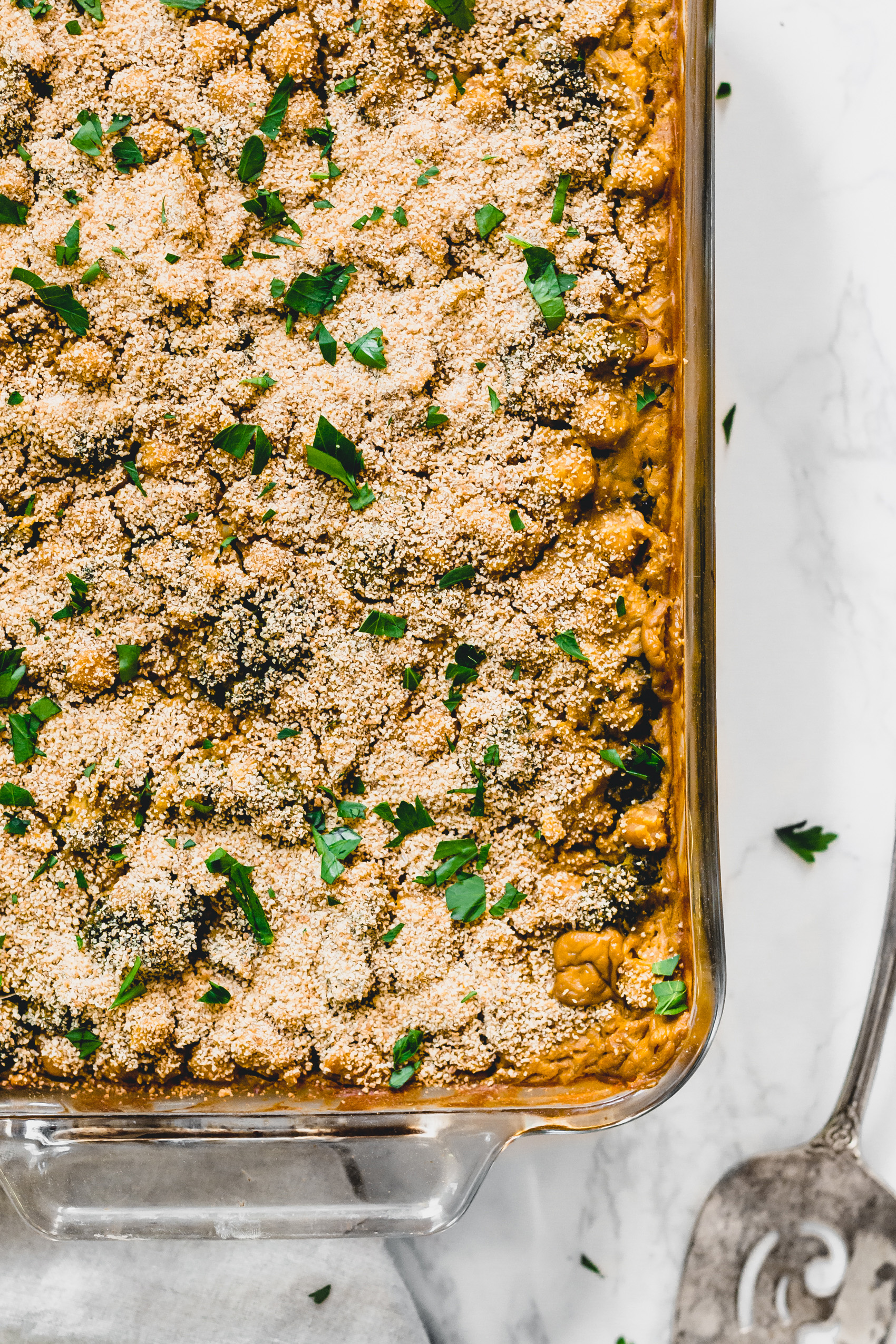 a casserole dish with a vegan cheese chickpea broccoli rice bake