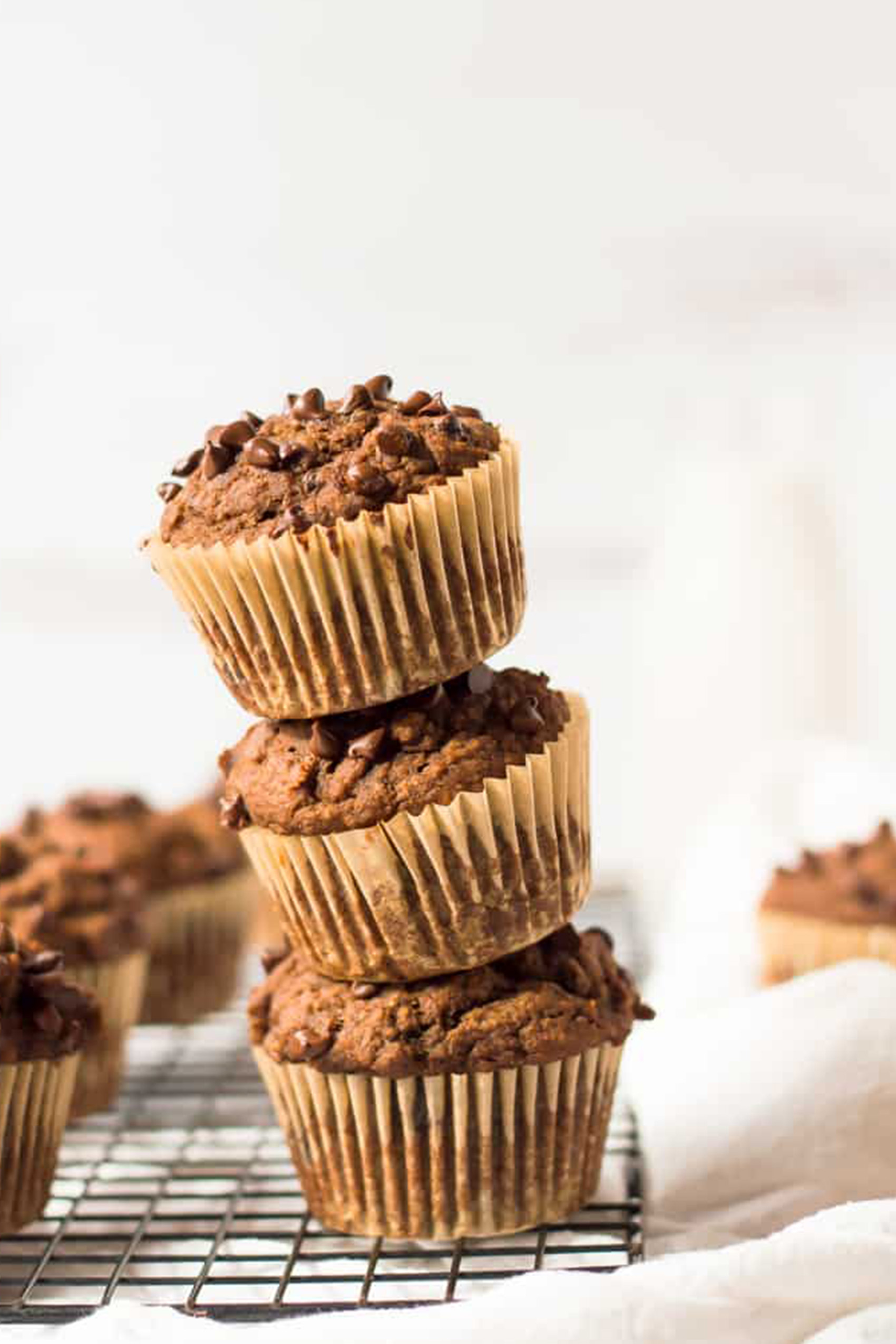 a stack of chocolate butternut squash muffins