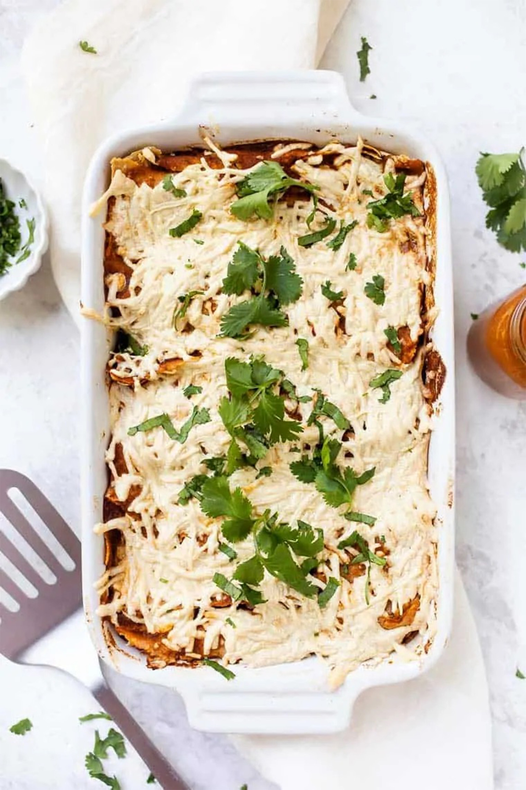 a baking dish filled with vegan enchiladas 