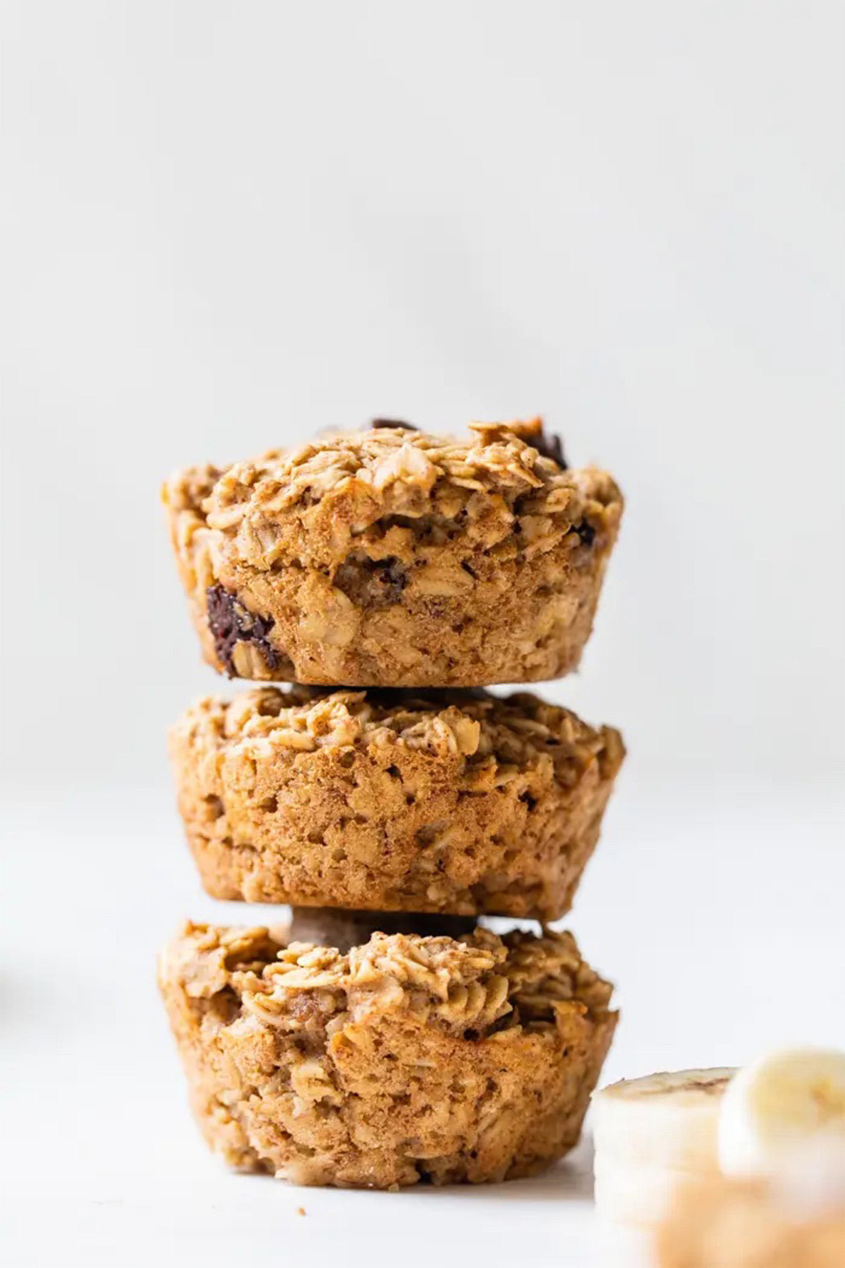 a stack of three baked oatmeal cups stacked on top of one another