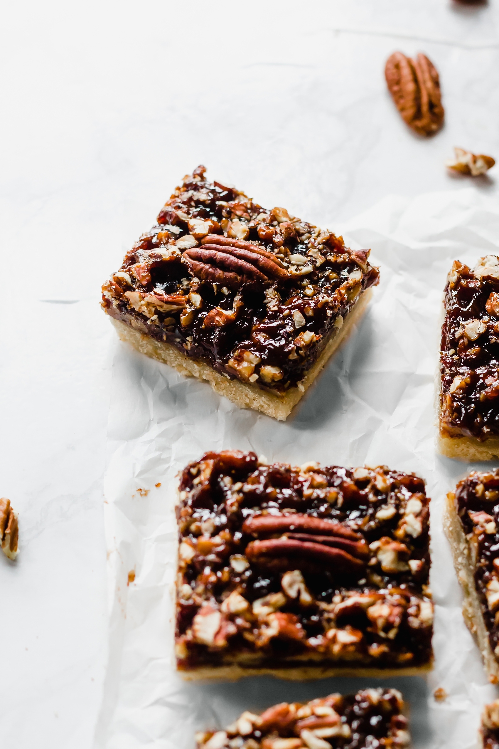 a batch of sliced pecan pie bars