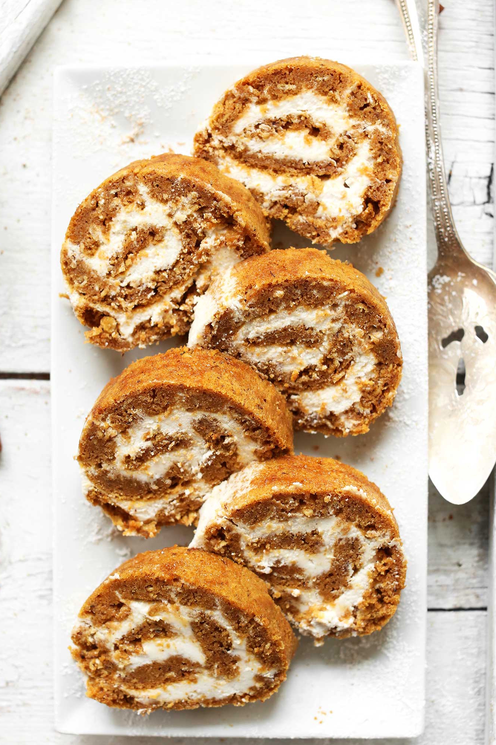 a pumpkin swiss roll sliced into pieces