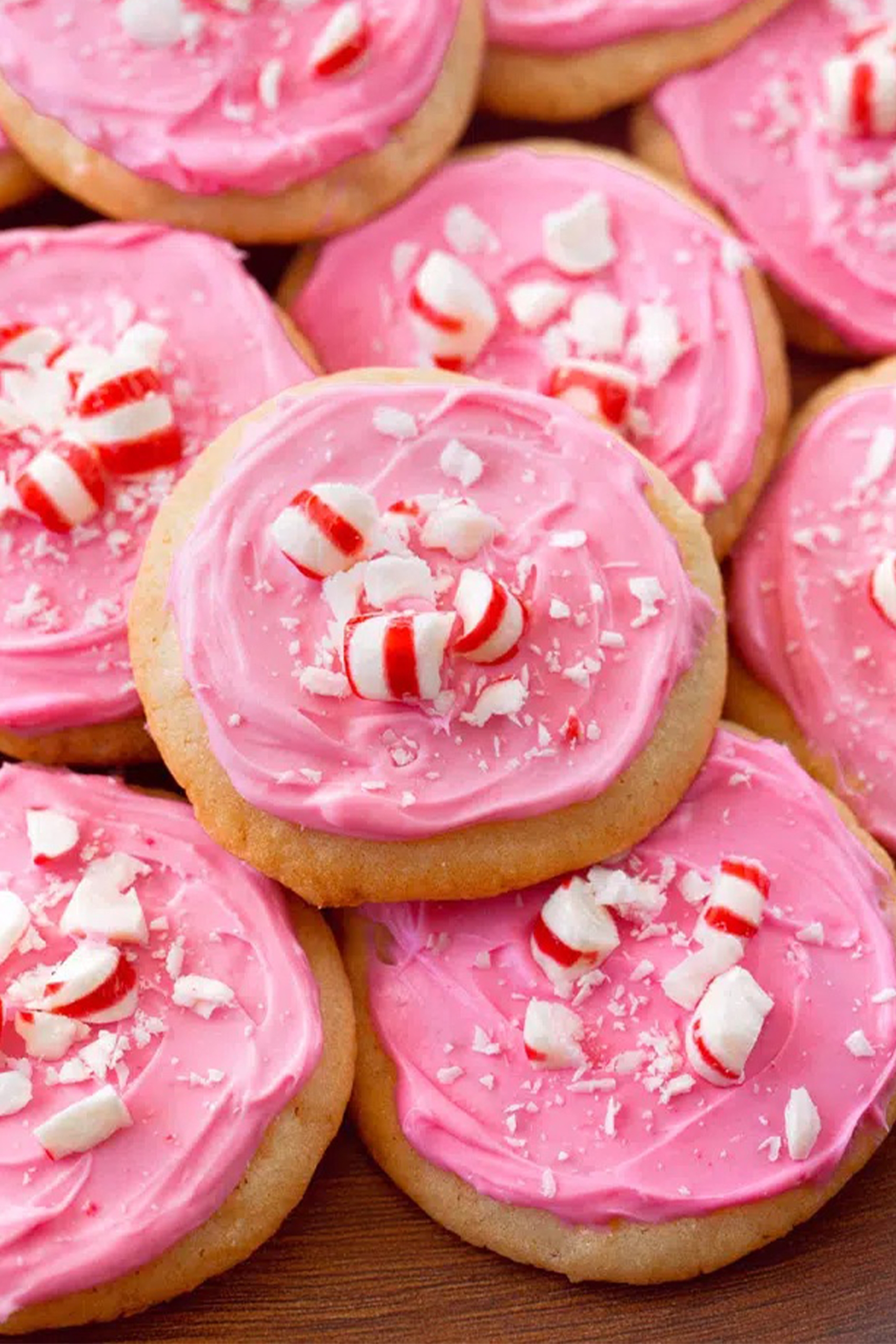 peppermint cookies topped with pink frosting
